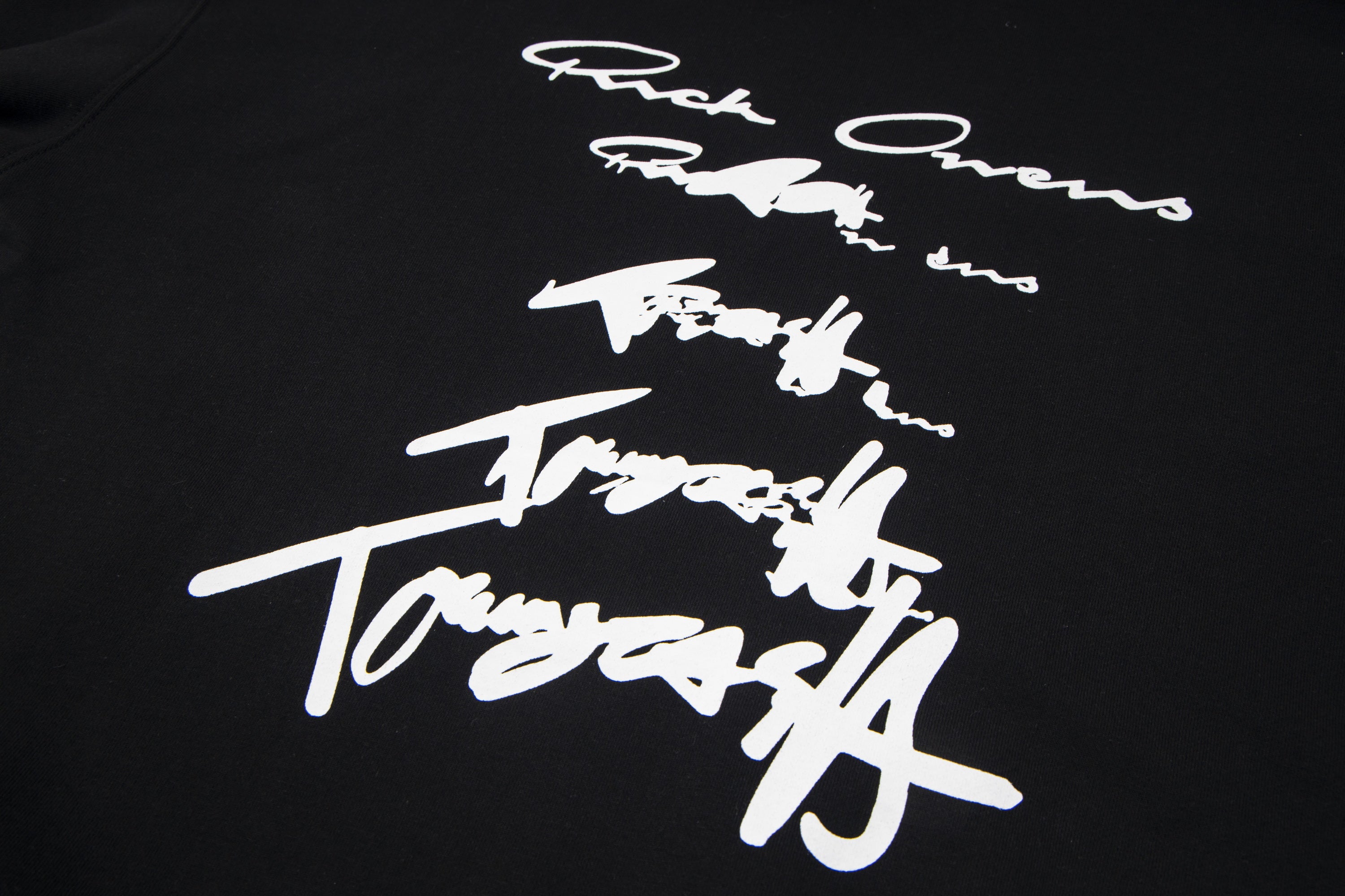 Dark hoodie with large white script logo graphic on chest