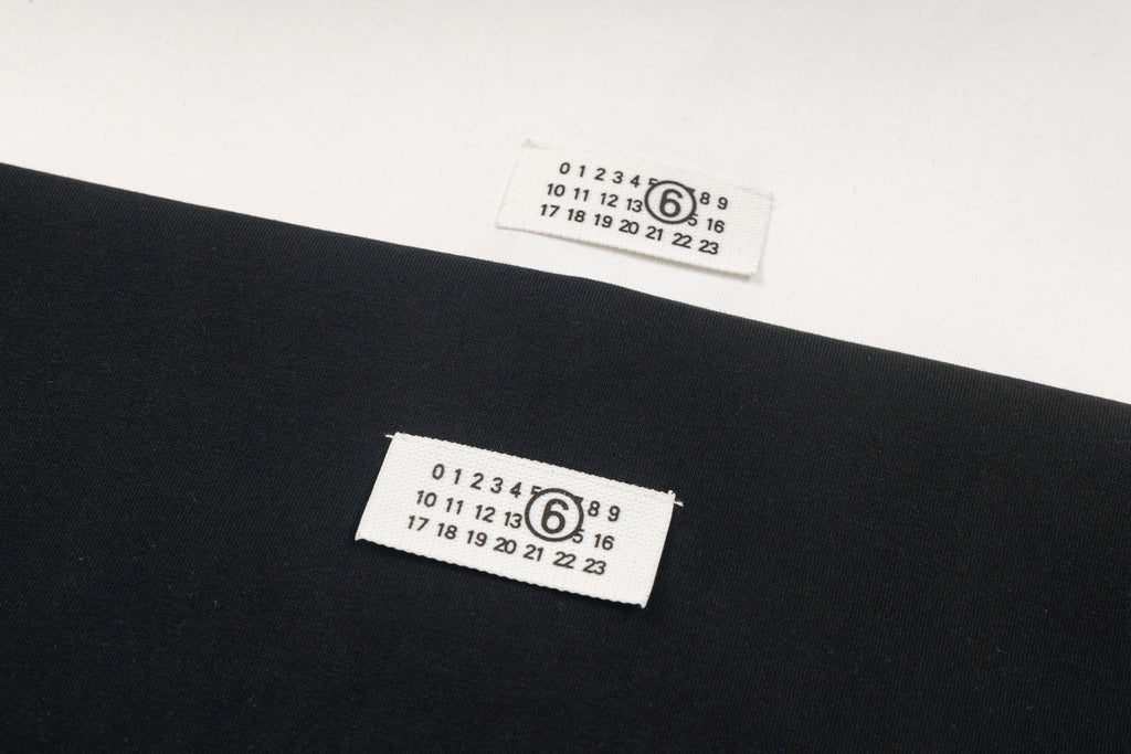 Black Maison Margiela T-shirt label with printed numbers