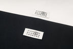 Black Maison Margiela T-shirt label with printed numbers