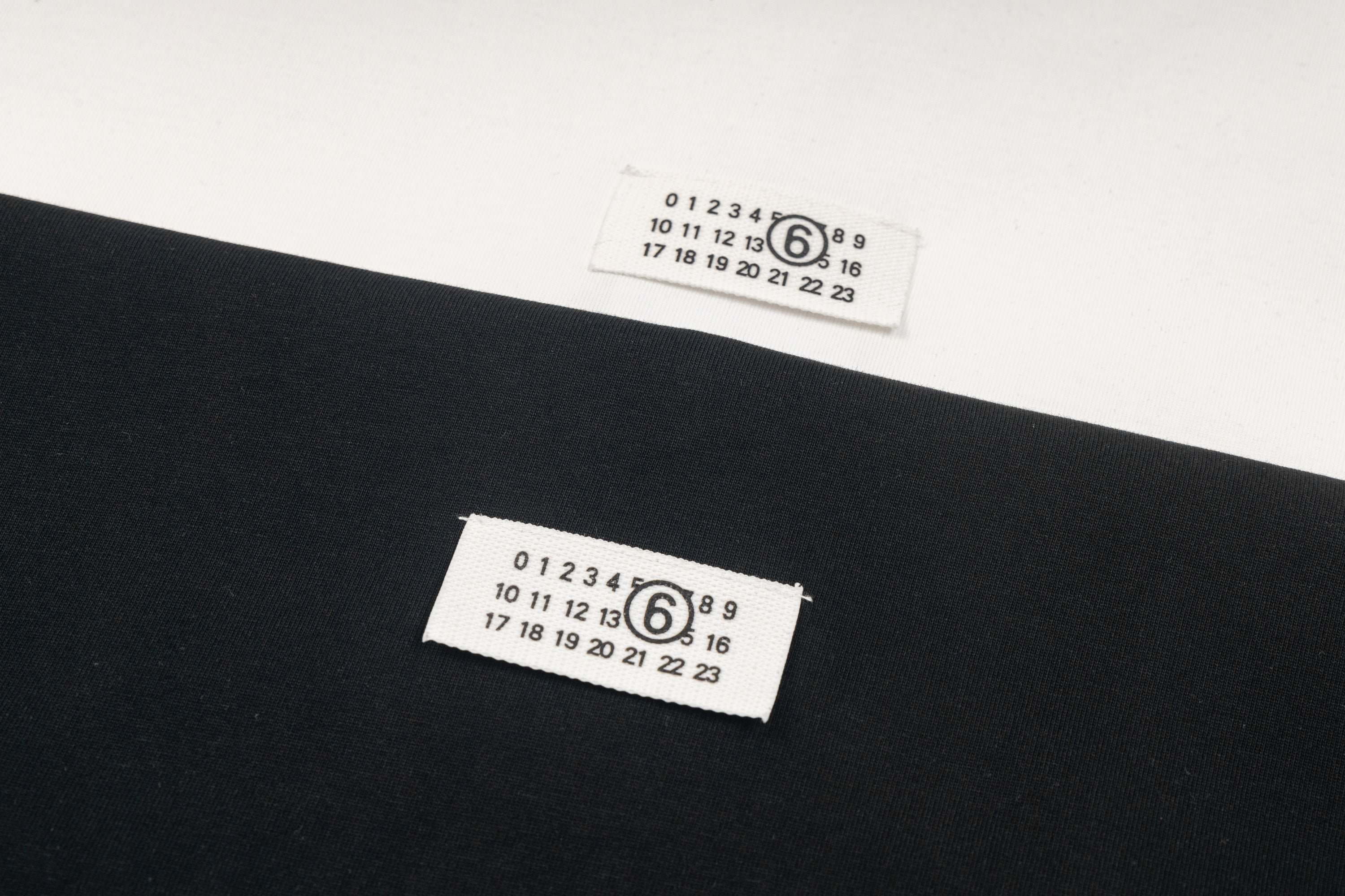 Black Maison Margiela T-shirt label with printed numbers