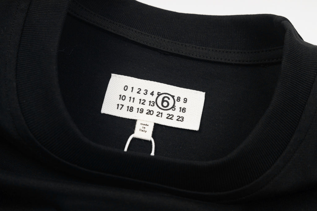 Black crewneck T-shirt neckline with front size label
