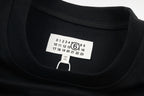Black crewneck T-shirt neckline with front size label