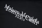 Black T-shirt close-up with Maison Margiela PARIS logo print