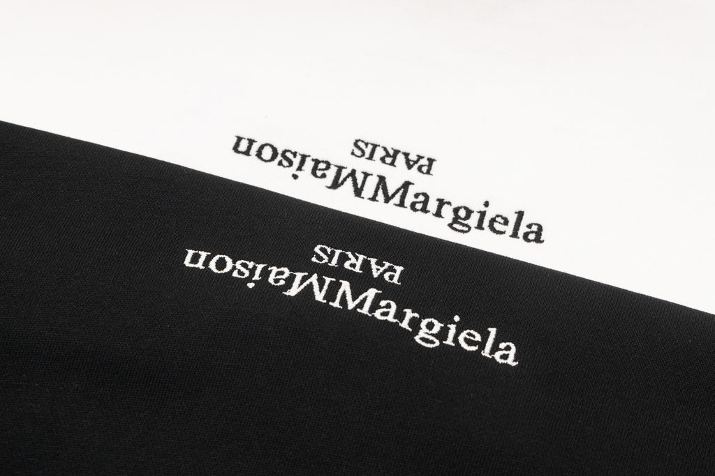 Black sweatshirt logo text close-up near neckline