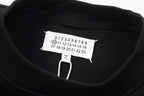 Black sweatshirt neckline with size label and hang tag