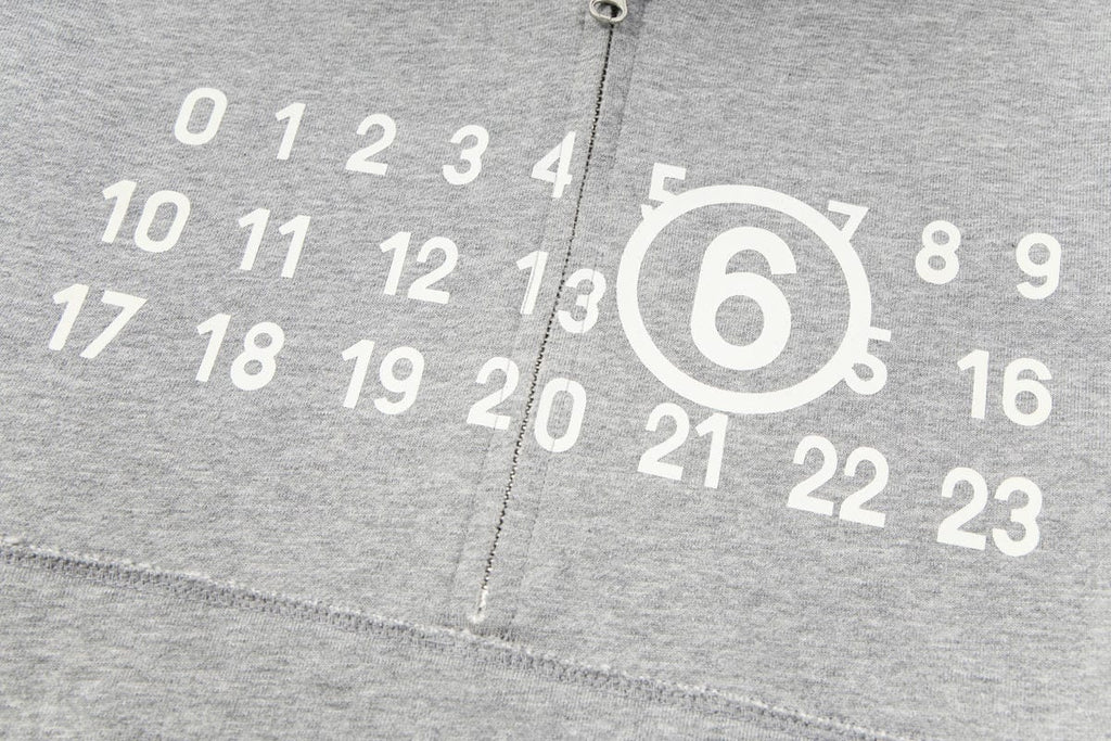 Grey hooded sweatshirt fabric with white number graphic and zipper seam detail