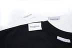 Black crewneck T-shirt neckline with Maison Margiela and Tommy Cash tags