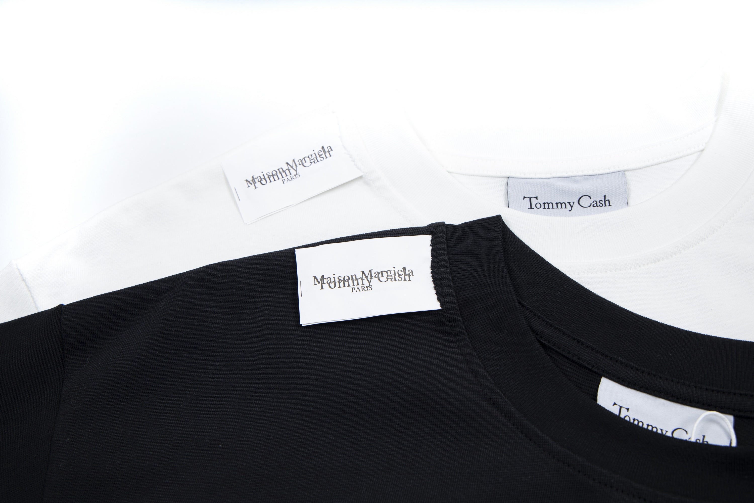 Black crewneck T-shirt neckline with Maison Margiela and Tommy Cash tags