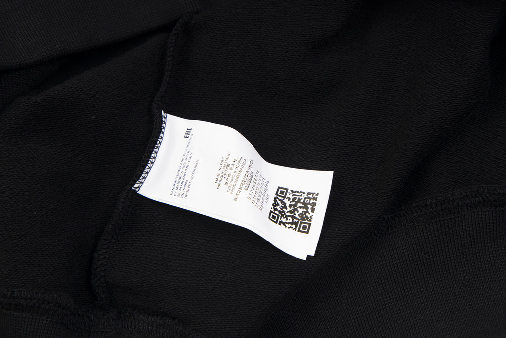 Maison Margiela hoodie neck label on black fabric