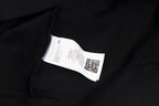 Maison Margiela hoodie neck label on black fabric