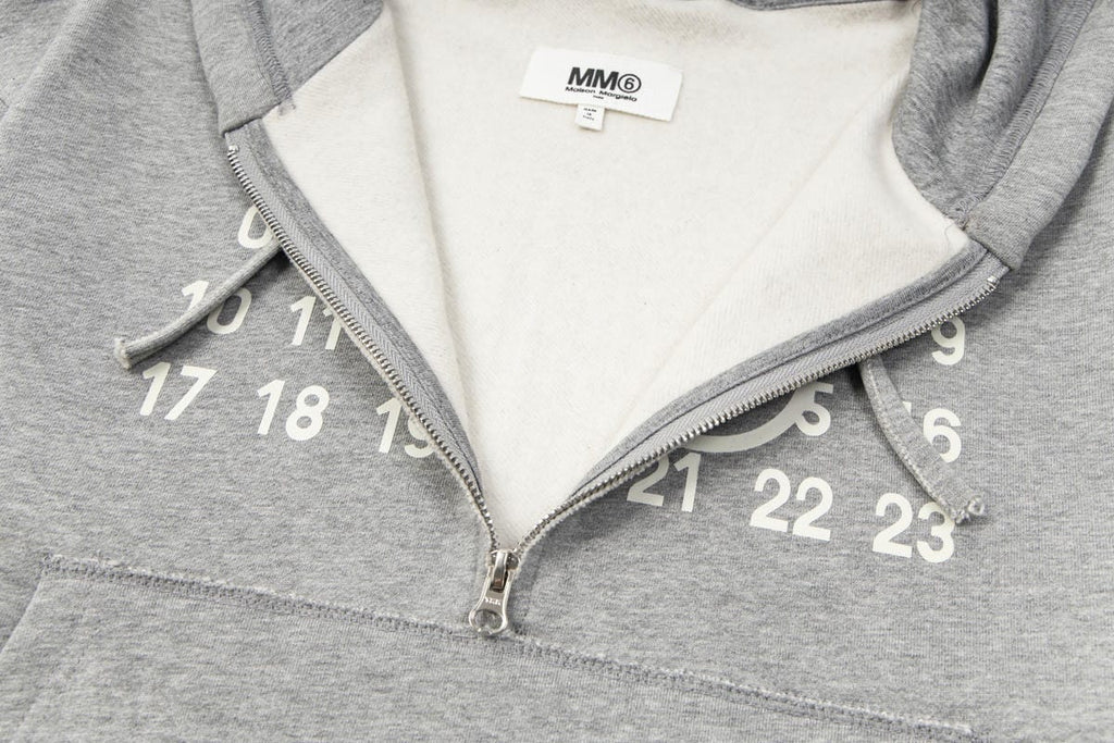 Heather grey hooded sweatshirt with half-zip and white number graphic on chest