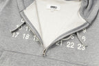 Heather grey hooded sweatshirt with half-zip and white number graphic on chest