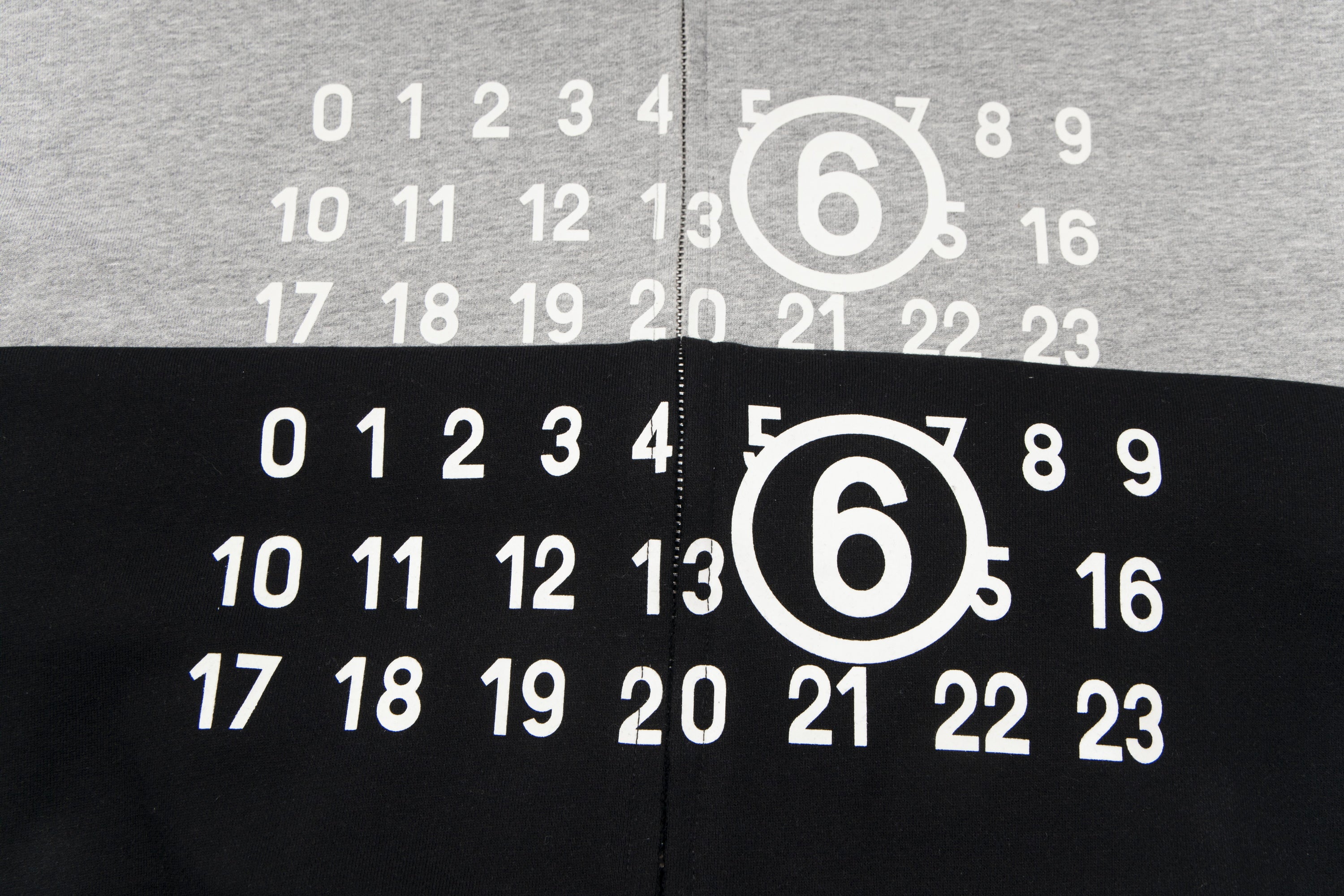 Hooded sweatshirt with number graphic on black and grey front panels