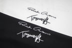 Close-up of signature-style graphic print on black T-shirt