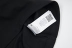 Black T-shirt with interior neck label showing Maison Margiela branding