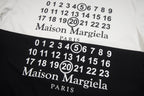 T-shirt print close-up with numerals and "Maison Margiela" "PARIS" text