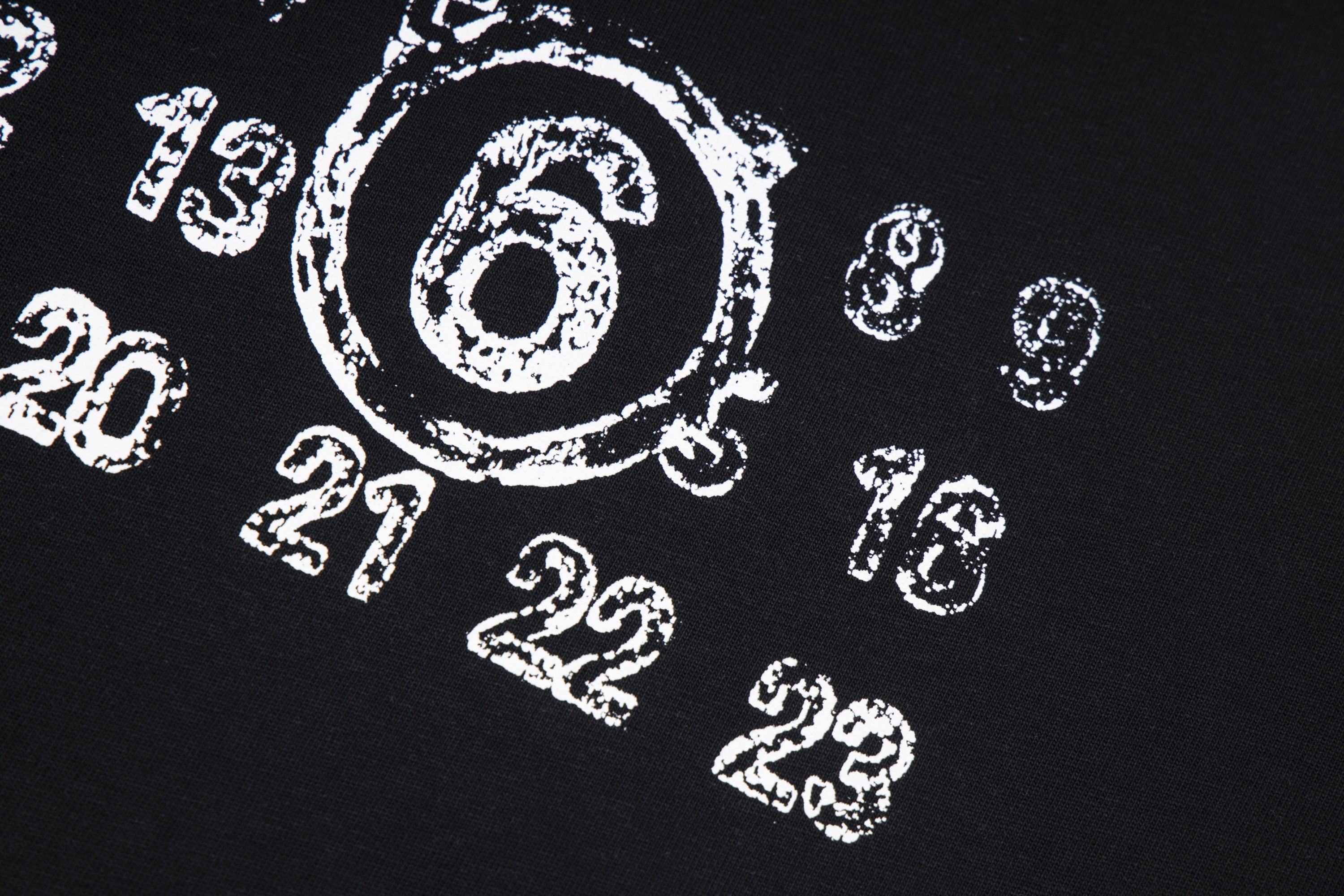 Black T-shirt fabric with white printed number graphic pattern