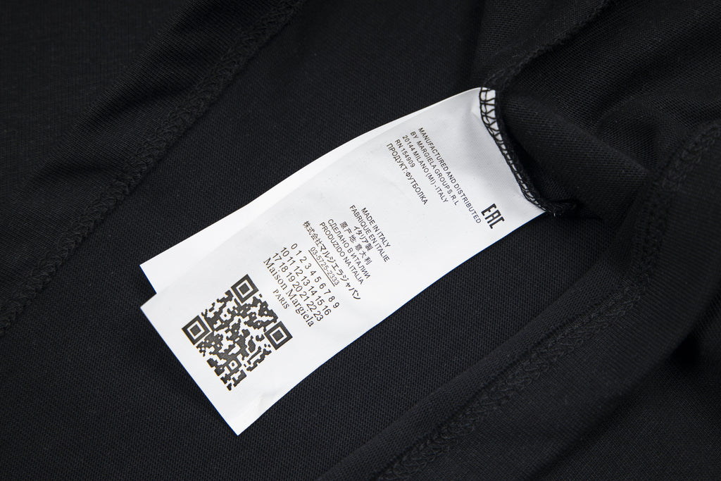 Black crewneck T-shirt with inner care label near the collar seam