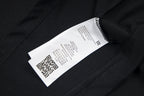 Black crewneck T-shirt with inner care label near the collar seam