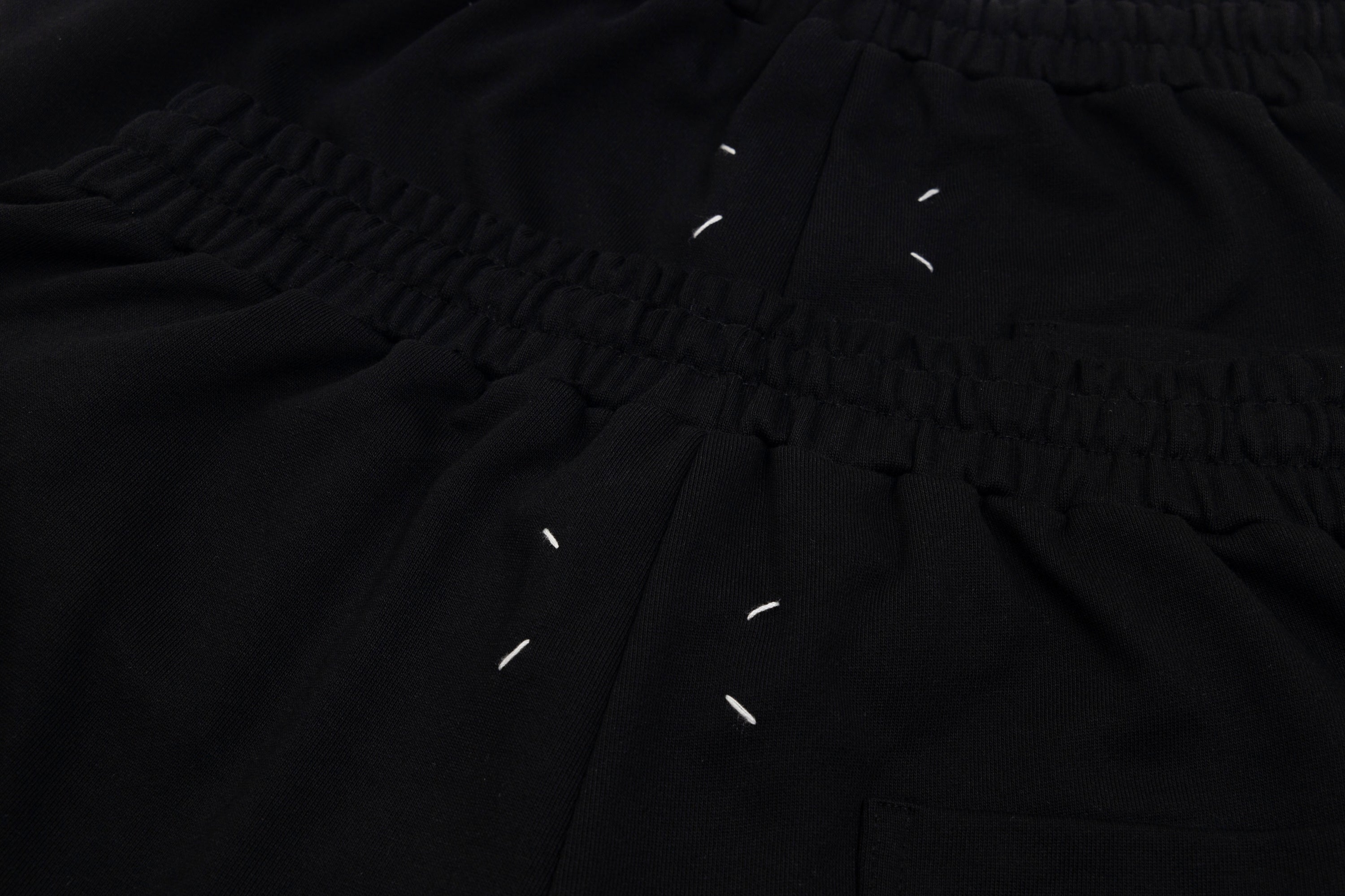 Black shorts close-up of gathered waistband and drawstring