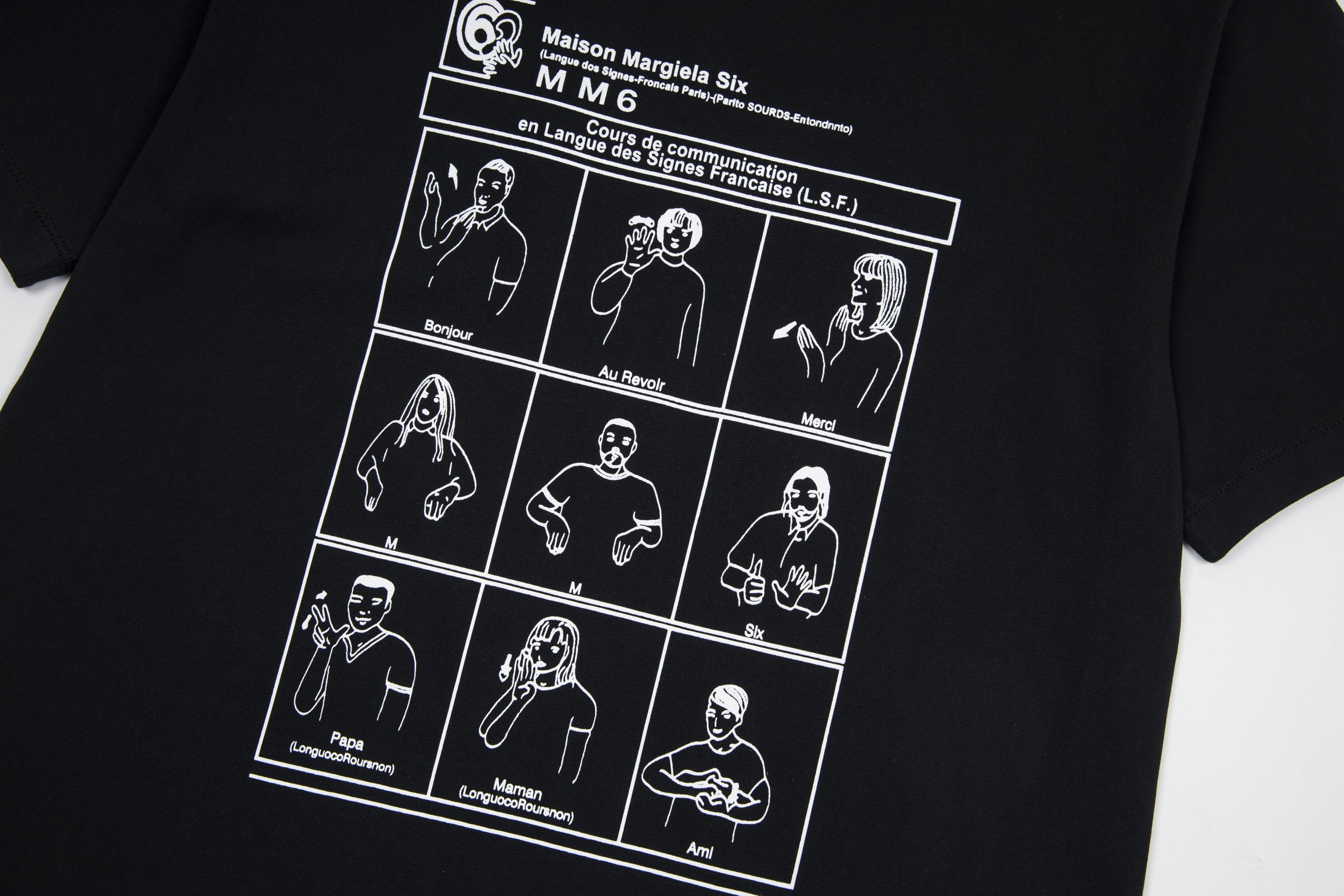 Black crewneck T-shirt with white illustrated character grid and text print