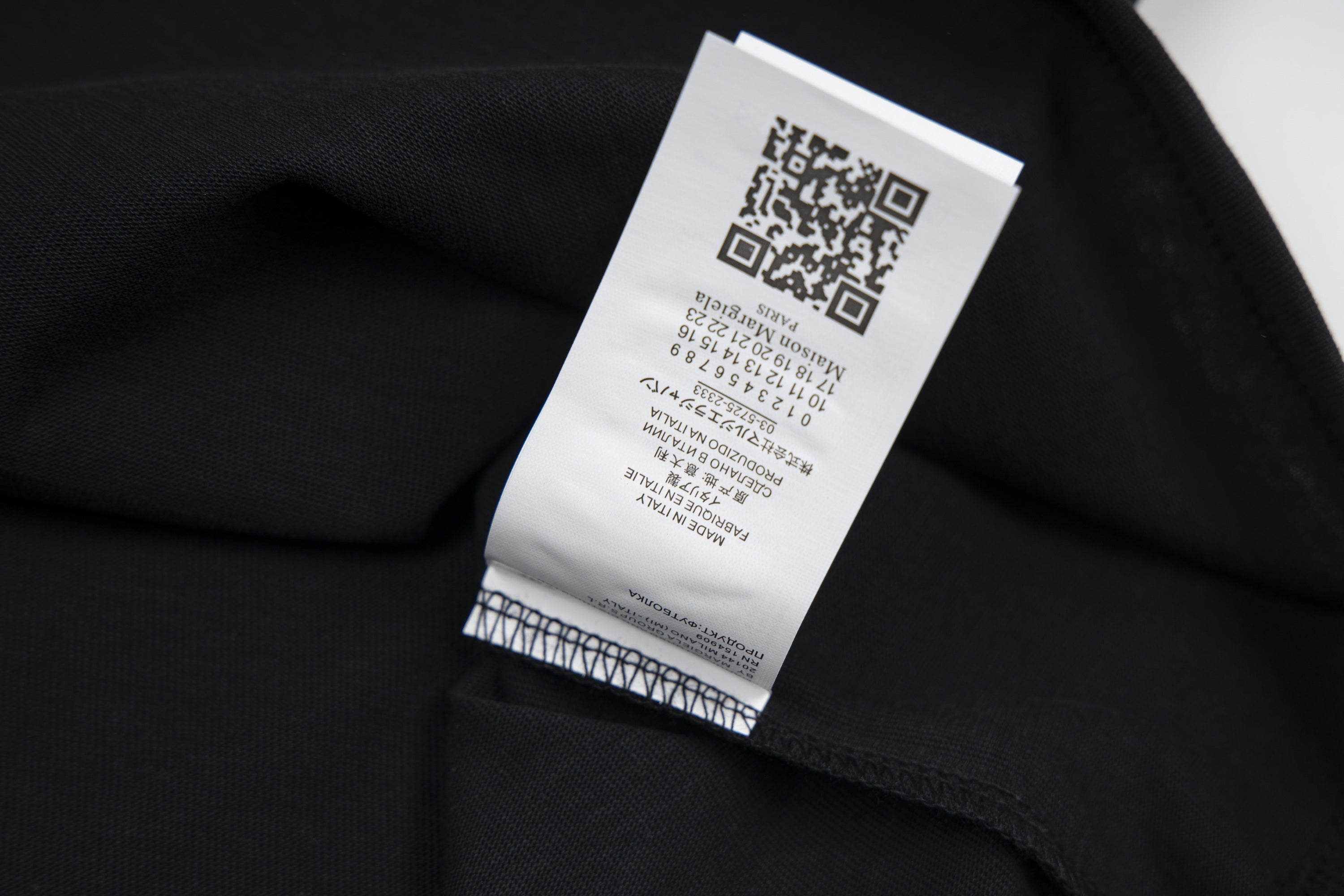 Black fabric clothing tag with QR code label