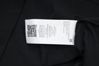 Black T-shirt interior neck label on fabric seam