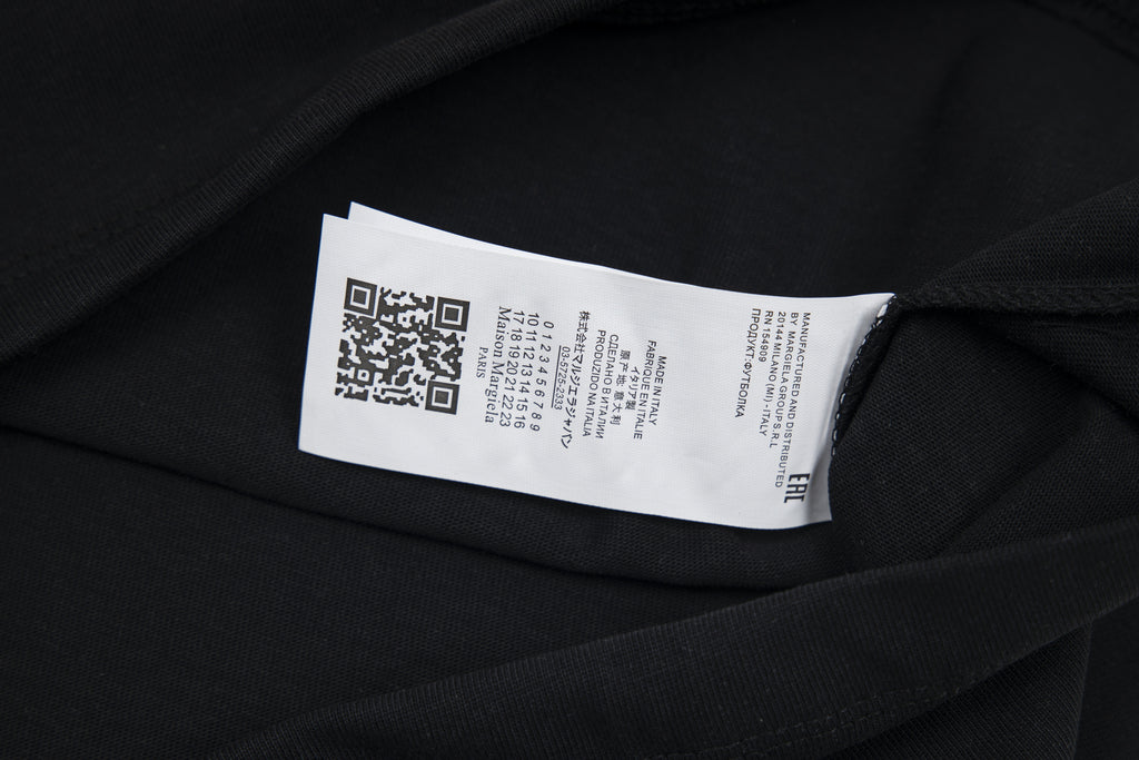 Black T-shirt care label on inside neckline