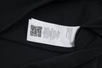 Black T-shirt care label on inside neckline