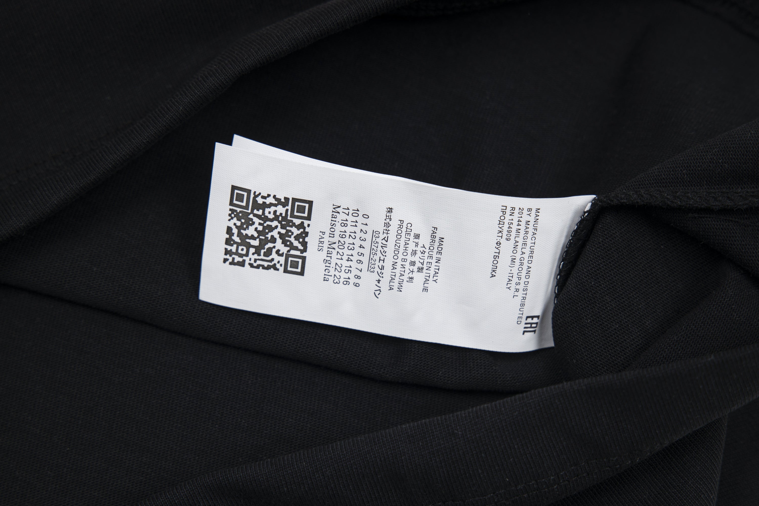 Black T-shirt care label on inside neckline