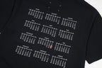 Black T-shirt close-up with white grid of numbers print