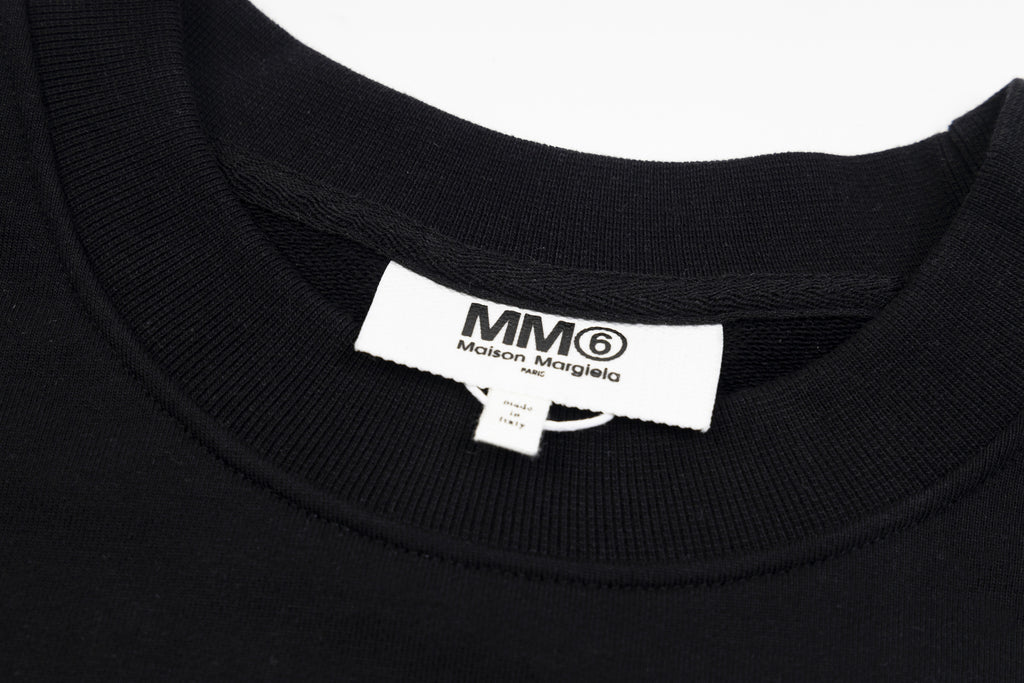 Black crewneck sweatshirt neck label with MM6 Maison Margiela branding