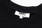 Black crewneck sweatshirt neck label with MM6 Maison Margiela branding