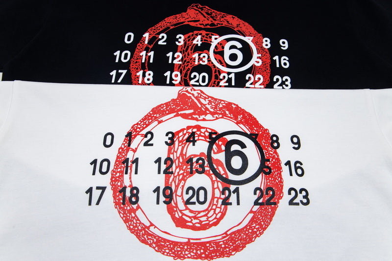 Graphic T-shirt close-up: red face numbers print on black and white fabric