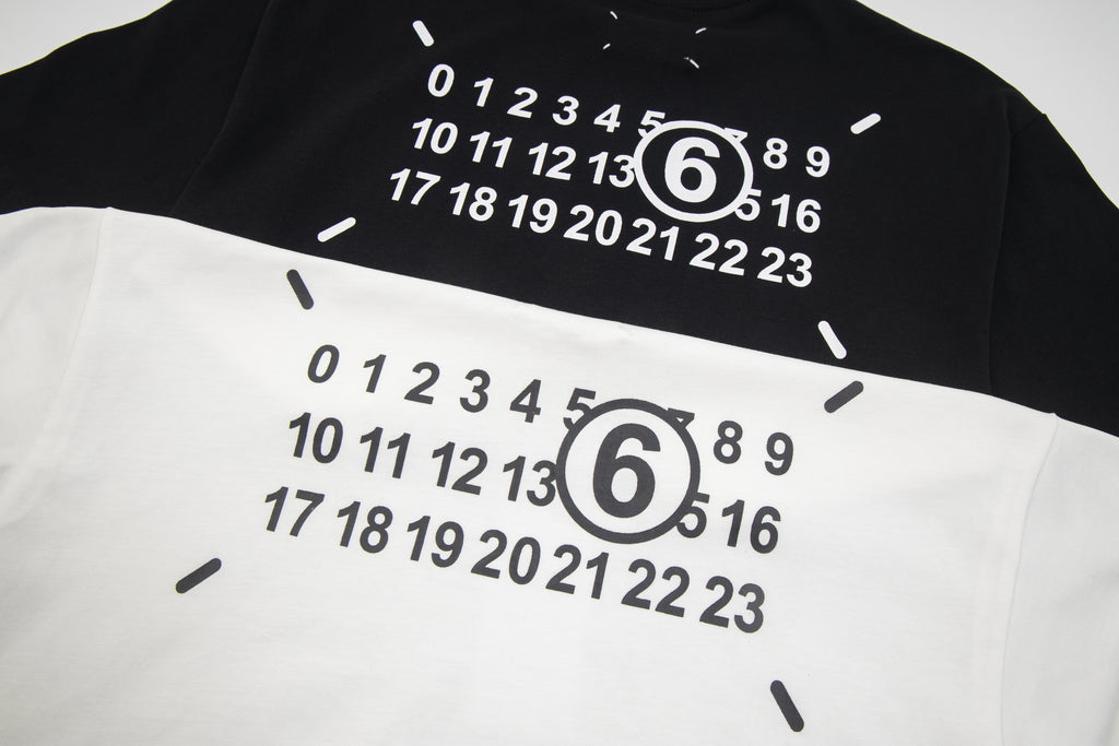 Close-up of numeric graphic print with large "6" on T-shirt fabric