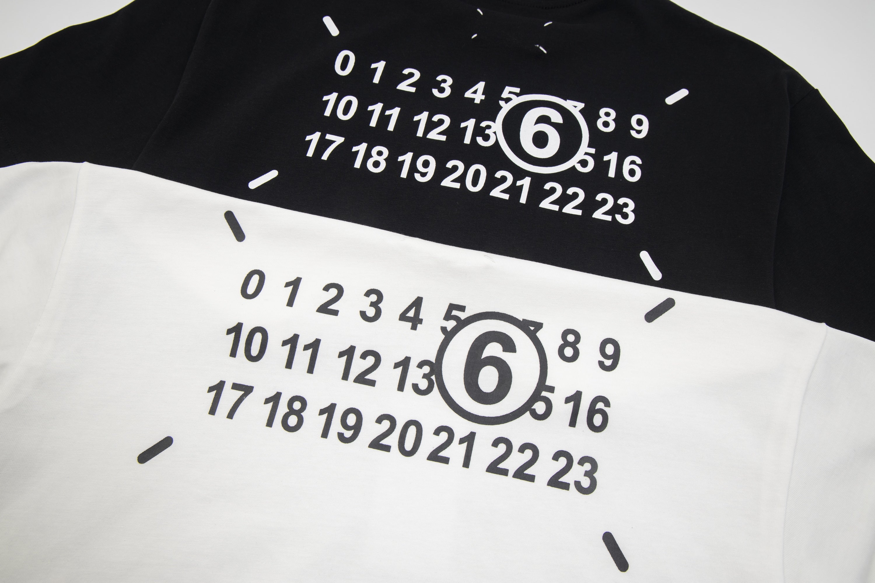 Close-up of numeric graphic print with large "6" on T-shirt fabric