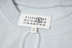 Maison Margiela T-shirt neck label with size numbers and logo