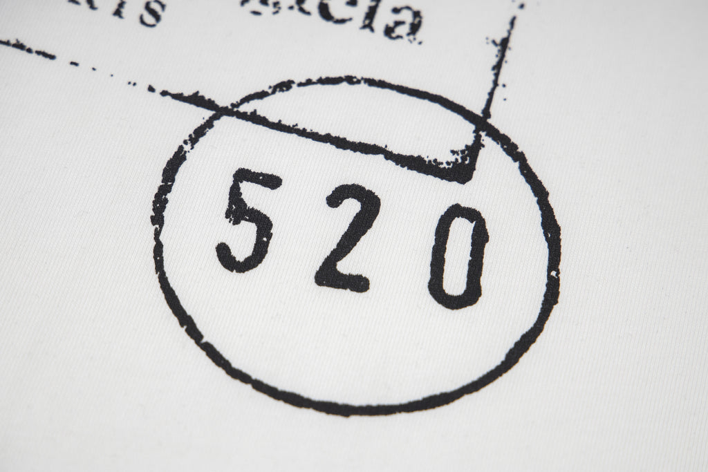 Close-up of 520 stamp on T-shirt logo patch