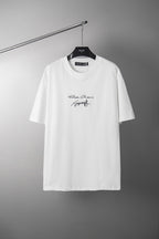 White crewneck T-shirt with small script logo graphic at chest