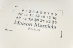 Cream T-shirt close-up of number graphic and “Maison Margiela PARIS”