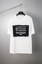 White crewneck T-shirt with black Maison Margiela number graphic on chest