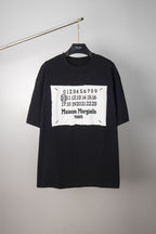 Black crewneck T-shirt with white Maison Margiela number graphic on chest