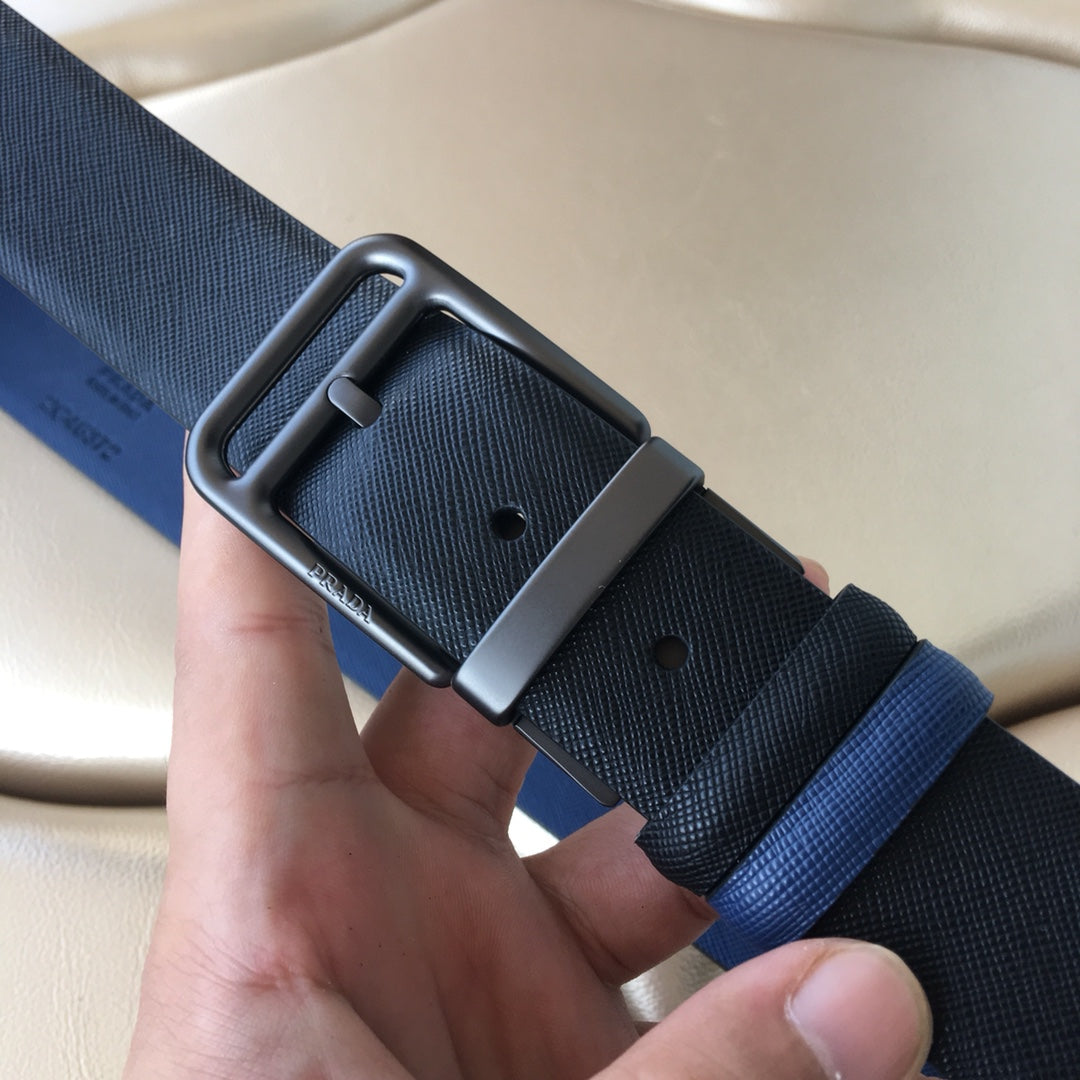 Prada belt detail: metal buckle on textured navy strap with adjustment holes