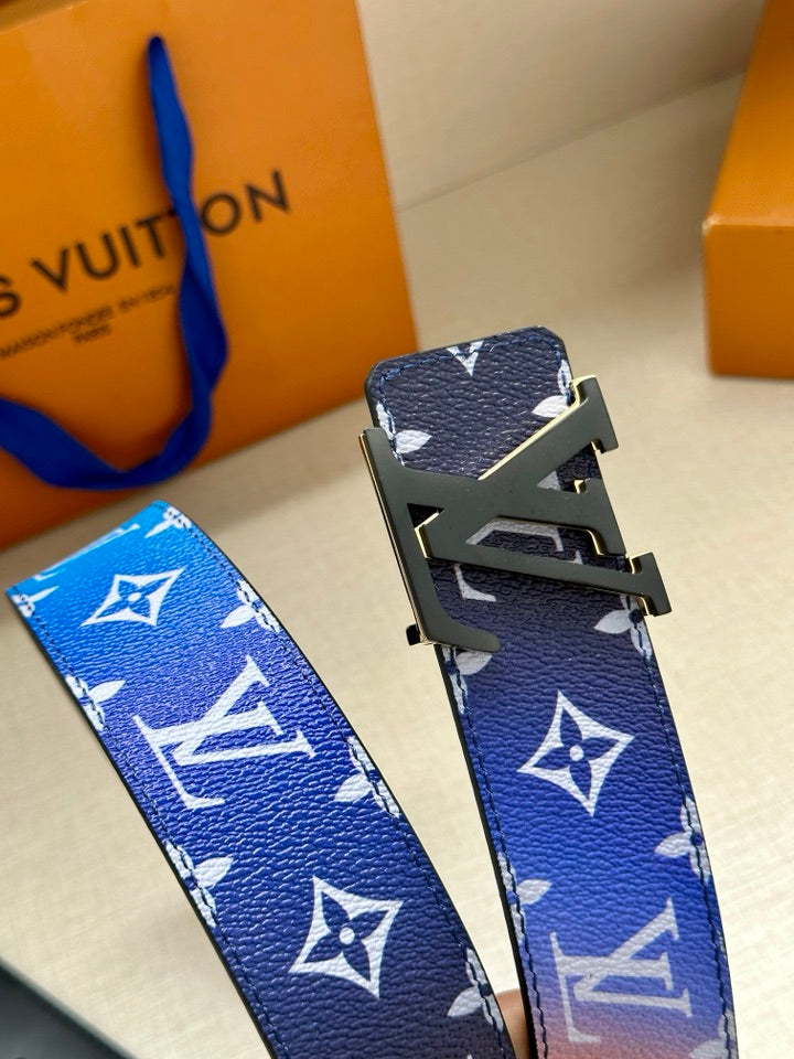 Blue monogram belt strap with gold-tone buckle and textured leather pattern