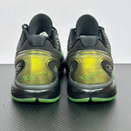 Pair of black and green basketball shoes, rear view with lime sole and ankle padding.