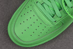 Green leather toe box with perforations and curved white outsole edge