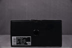 Black sneaker shoebox with size label sticker