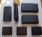Louis Vuitton small wallets: dark checker and brown monogram zip styles, several