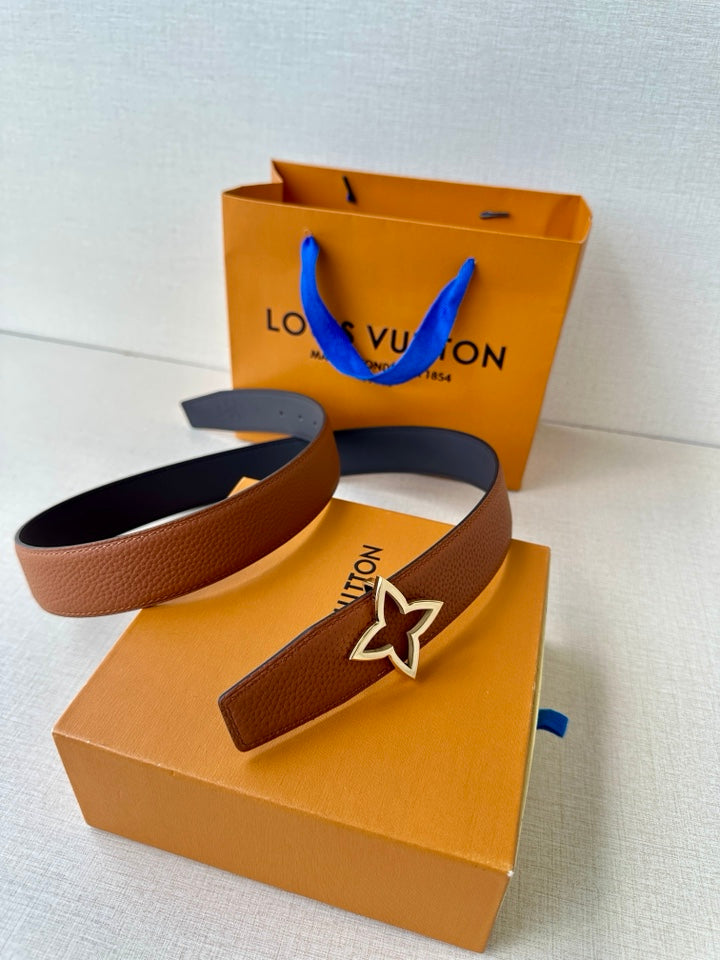 Louis Vuitton brown leather belt with star buckle, flat lay view