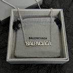 Silver Balenciaga logo pendant necklace with link chain